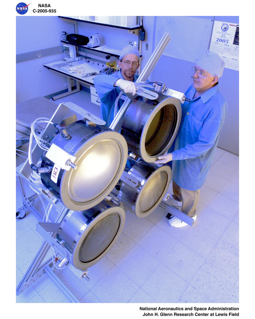 NEXT (NASA Evolutionary Xenon Thruster) ion thruster array being assembled for testing.