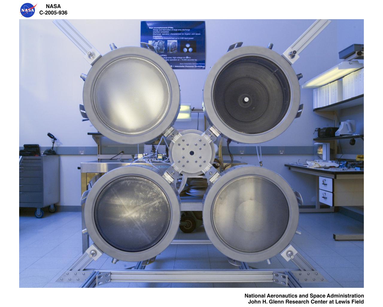 NEXT (NASA Evolutionary Xenon Thruster) ion thruster array being assembled for testing.