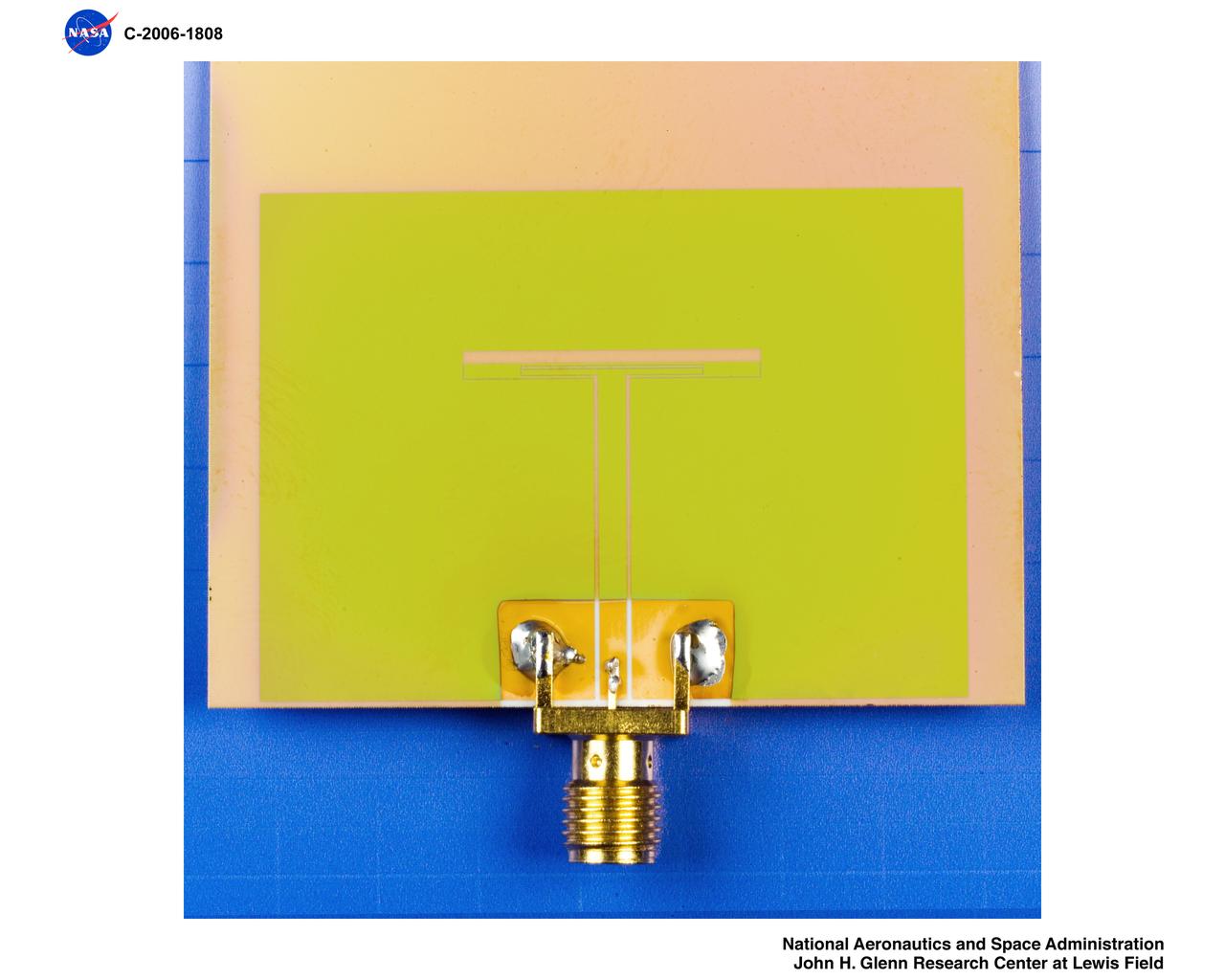 Dual Frequency Slot Antenna with SiC Thin Film Packaging Technology