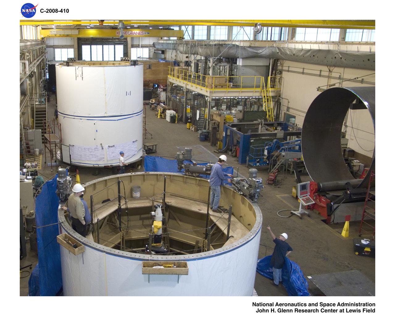 Inside Building 50, US-5 in foreground flange being milled, US-4 stacked on US-3 and steel rolled setting on Davi.