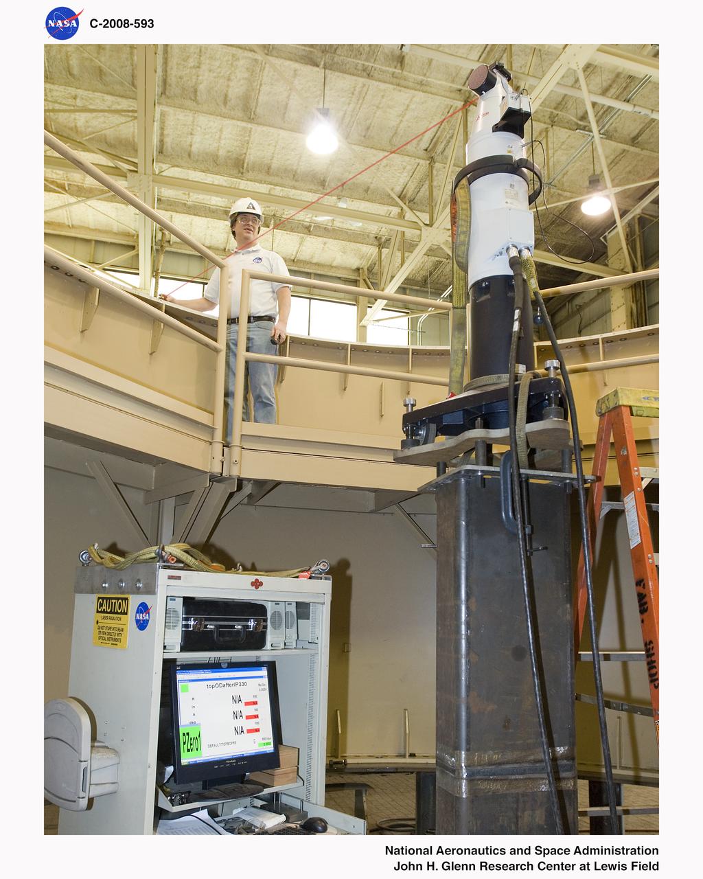 Laser level system in use on an Ares 1-X segment checking for level on the flange