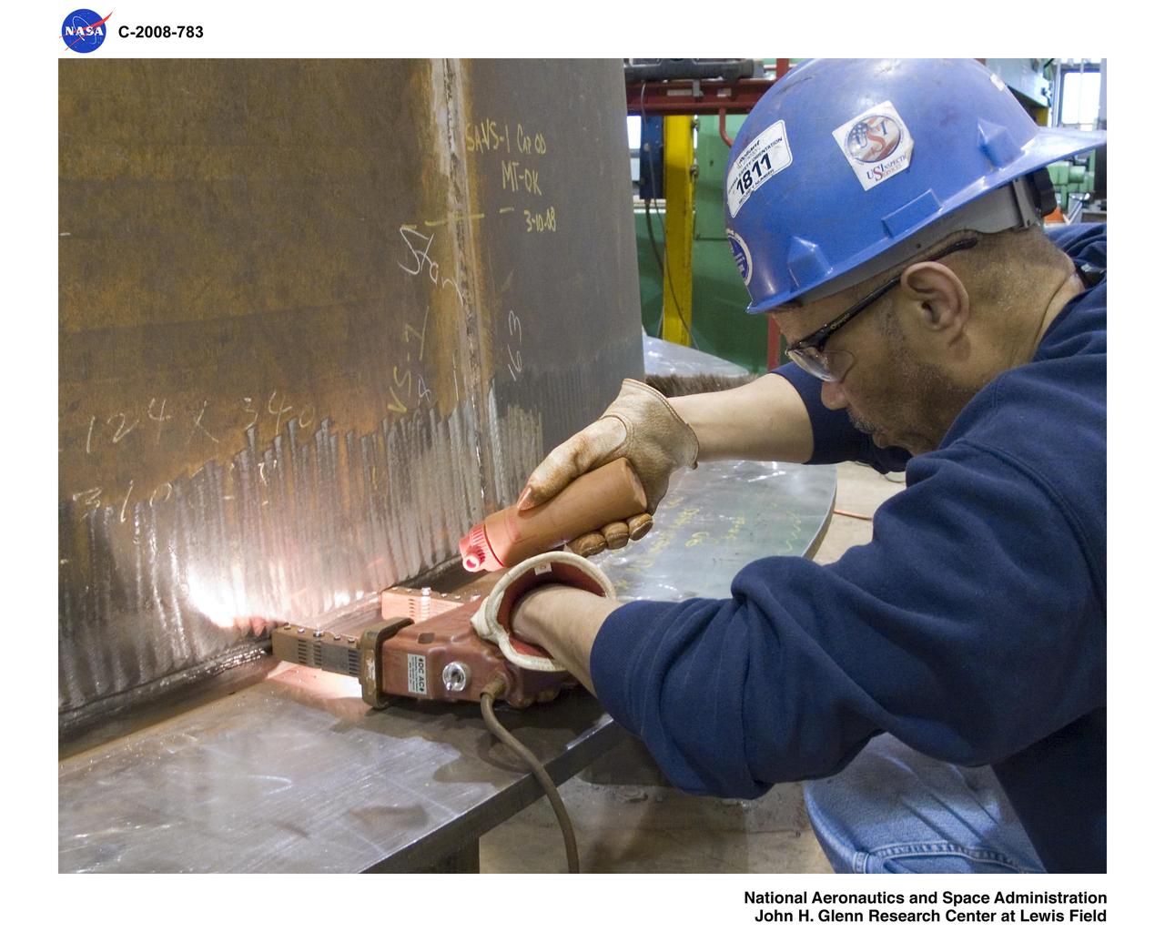 BLDG 50, Harold I. Johns checking welds "Magnetic Particle testing" Ares-1-X segment.
