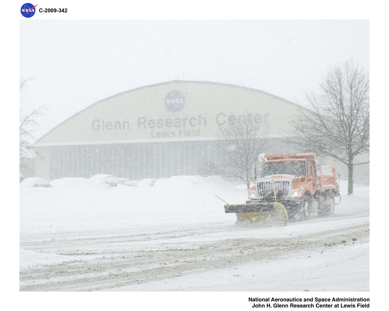Snowplowing on Taylor Road in front of the Hangar