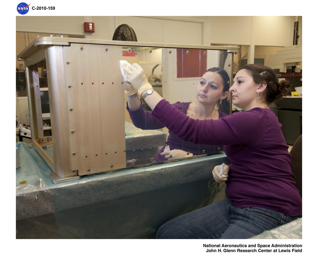 Communications, Navigation, and Networking Reconfigurable Test-bed, CoNNeCT; Silver Teflon Foil Installation