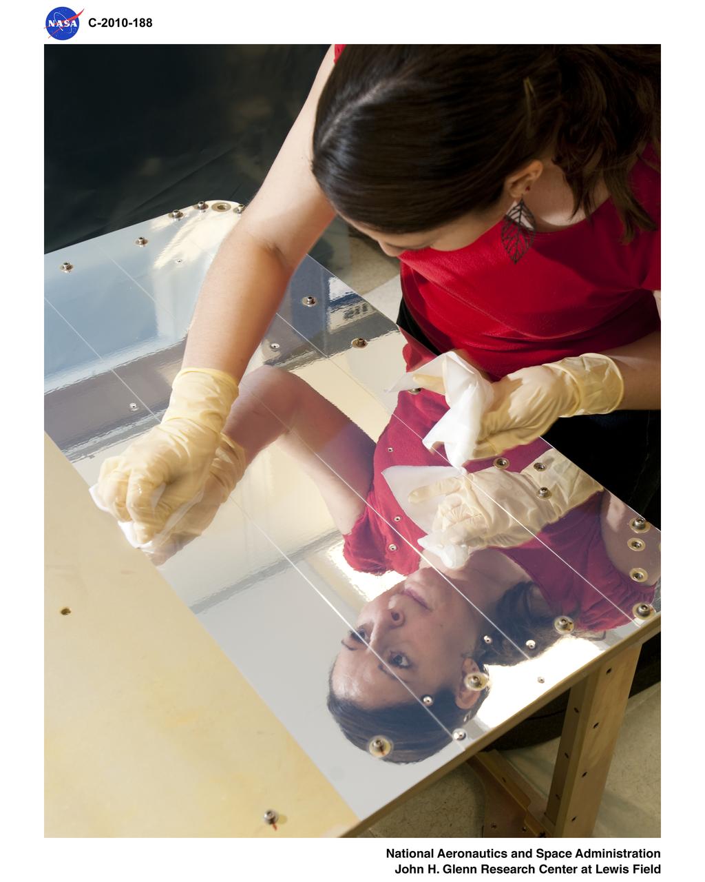 Communications, Navigation, and Networking Reconfigurable Test-bed, CoNNeCT; Silver Teflon Foil Installation