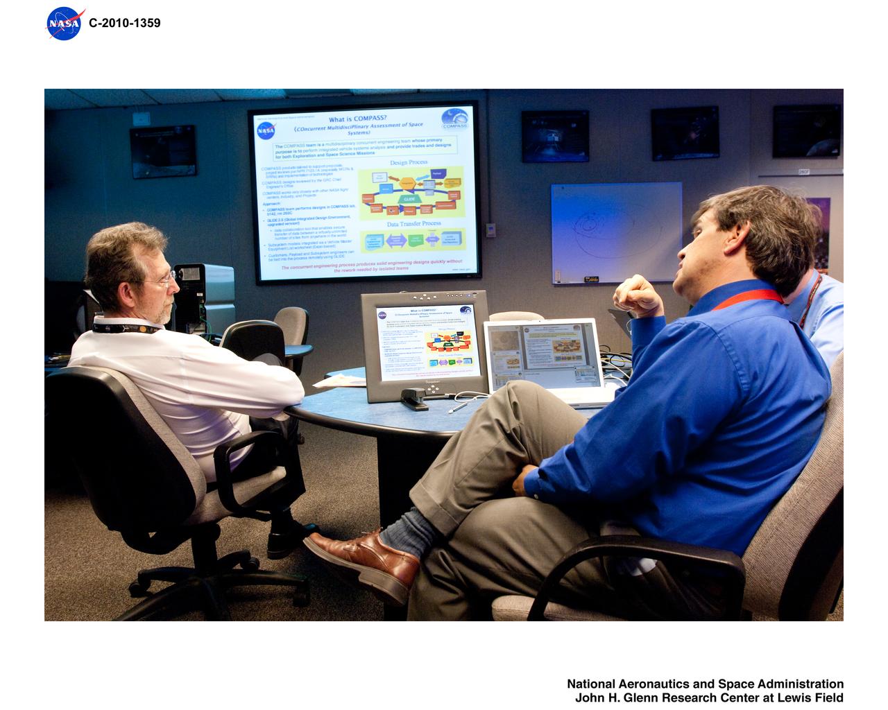 Planetary Science Lead, Jim Green being briefed on recent conceptual designs by the Lead of the COMPASS concurrent engineering design team at NASA Glenn Research Center.  COMPASS = COllaborative Modeling for Parametric Assessment of Space Systems