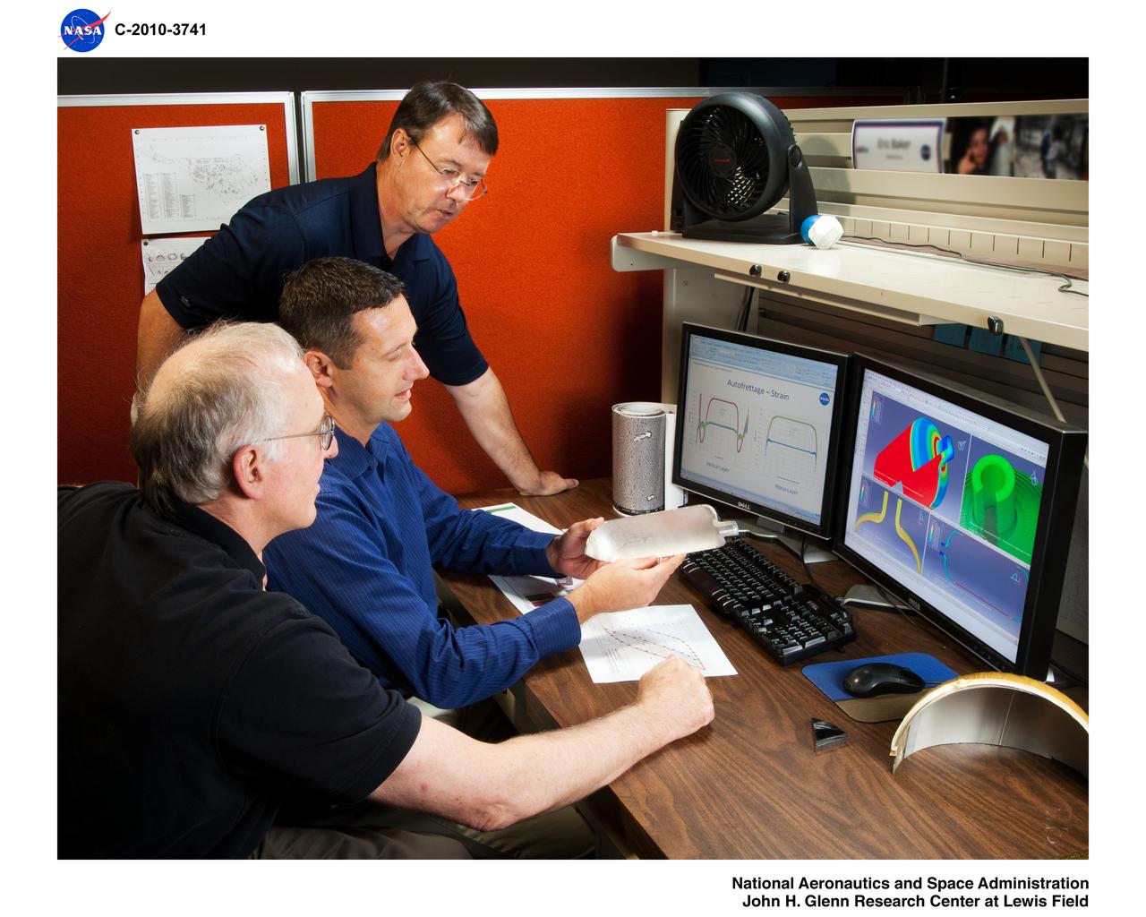 NASA Engineering and Safety Center (NESC) Composite Overwrapped Pressure Vessel (COPV) Working Group members examine mechanical response simulations of proposed stress rupture test articles
