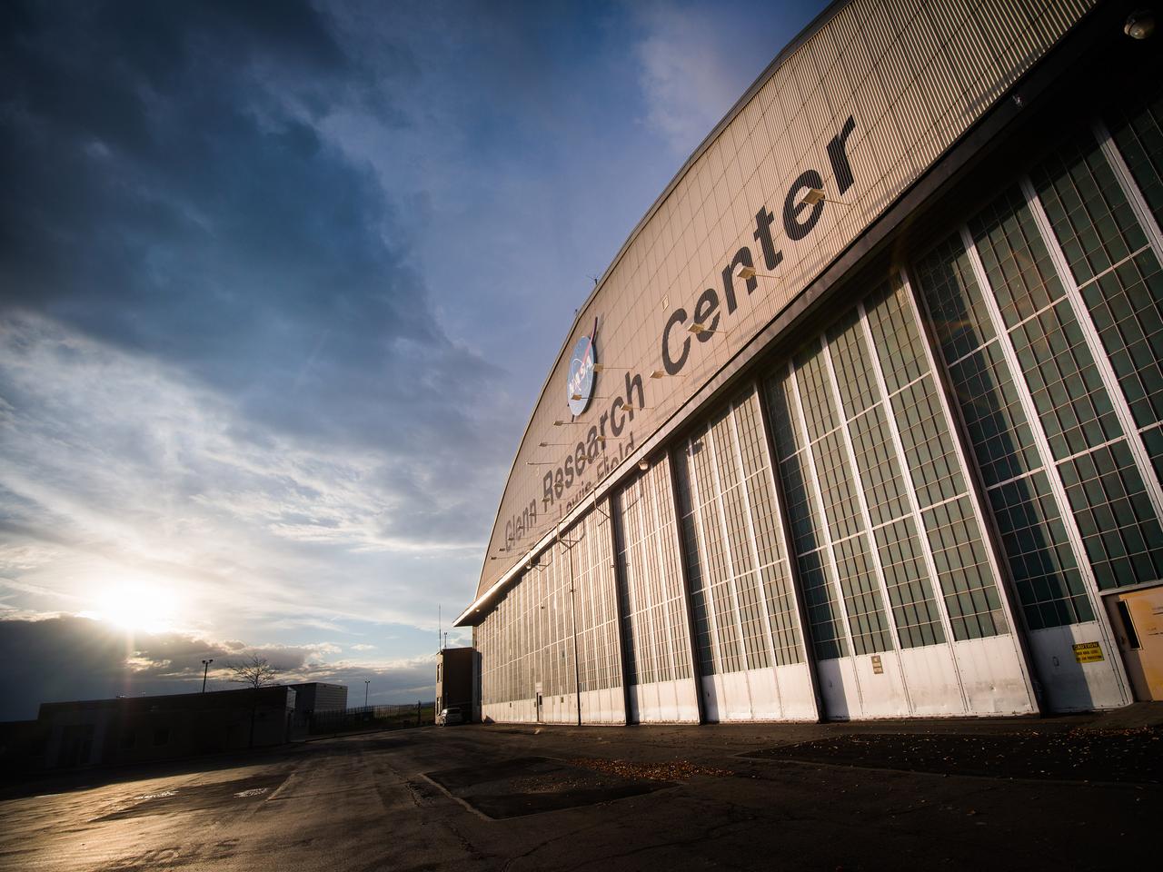 Sunrise in late September illuminates the front of the Hangar at NASA Glenn Research Center.