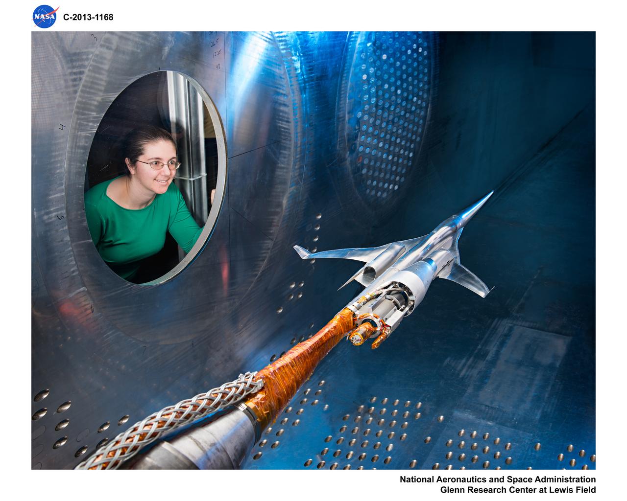 Supersonic Aircraft Model The window in the sidewall of the 8- by 6-foot supersonic wind tunnel at NASA's Glenn Research Center shows a 1.79 percent scale model of a future concept supersonic aircraft built by The Boeing Company. In recent tests, researchers evaluated the performance of air inlets mounted on top of the model to see how changing the amount of airflow at supersonic speeds through the inlet affected performance. The inlet on the pilot's right side (top inlet in this side view) is larger because it contains a remote-controlled device through which the flow of air could be changed. The work is part of ongoing research in NASA's Aeronautics Research Mission Directorate to address the challenges of making future supersonic flight over land possible. Researchers are testing overall vehicle design and performance options to reduce emissions and noise, and identifying whether the volume of sonic booms can be reduced to a level that leads to a reversal of the current ruling that prohibits commercial supersonic flight over land. Image Credit: NASA/Quentin Schwinn