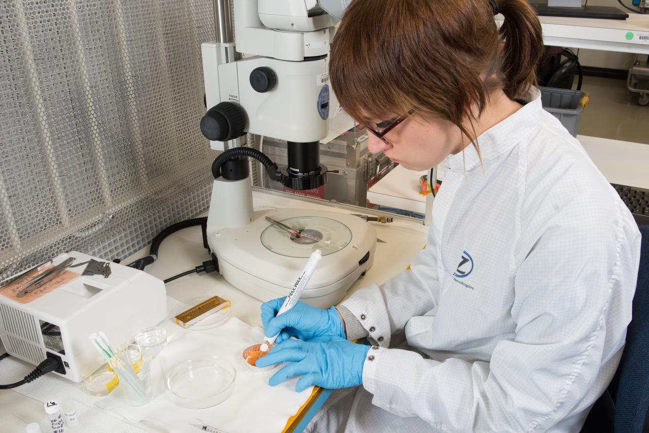 NASA (Zin Technologies) engineer prepares Advanced Colloid Experiment Heated-2 samples that will be analyzed aboard the International Space Station using the zero-gravity Light Microscopy Module, LMM in the Fluids Integrated Rack, FIR