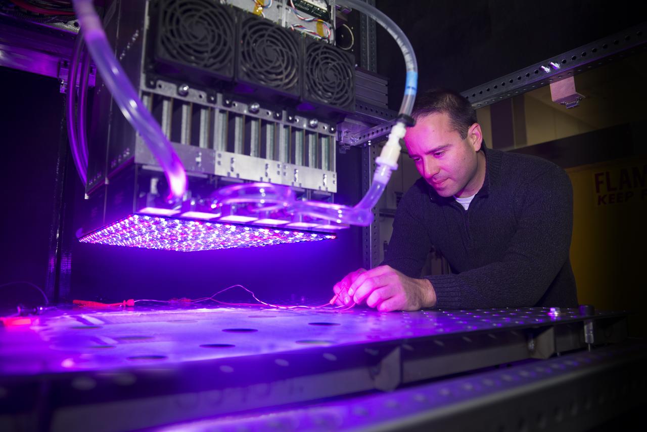 NASA Glenn's new LED solar simulator was developed by Angstrom Designs and UC Santa Barbara under a Small Business Innovative Research program to test the next generation of high-efficiency space solar cells for future missions. The new simulator contains over 1500 individually adjustable light sources, most of which emit light invisible to the human eye, to cover a 10 x10 foot area.