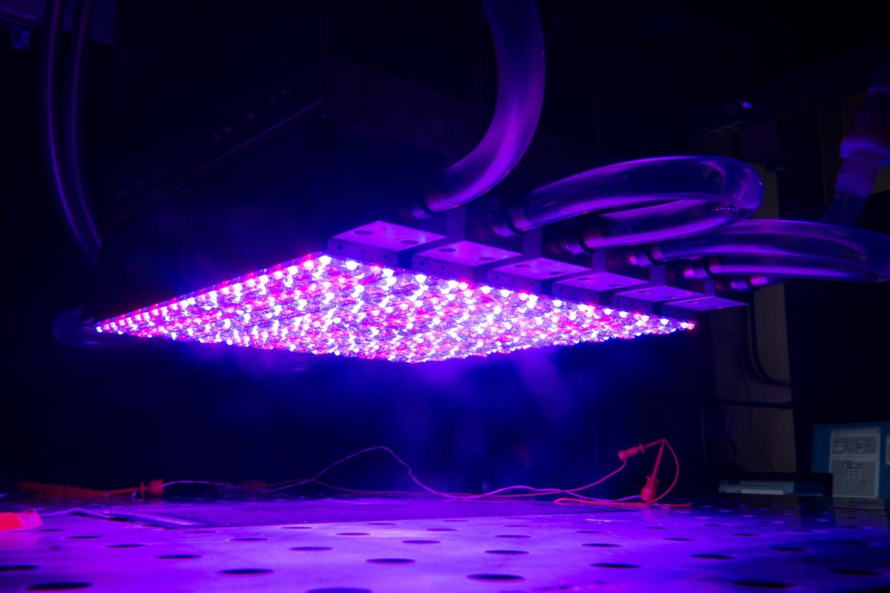 NASA Glenn's new LED solar simulator was developed by Angstrom Designs and UC Santa Barbara under a Small Business Innovative Research program to test the next generation of high-efficiency space solar cells for future missions. The new simulator contains over 1500 individually adjustable light sources, most of which emit light invisible to the human eye, to cover a 10 x10 foot area.