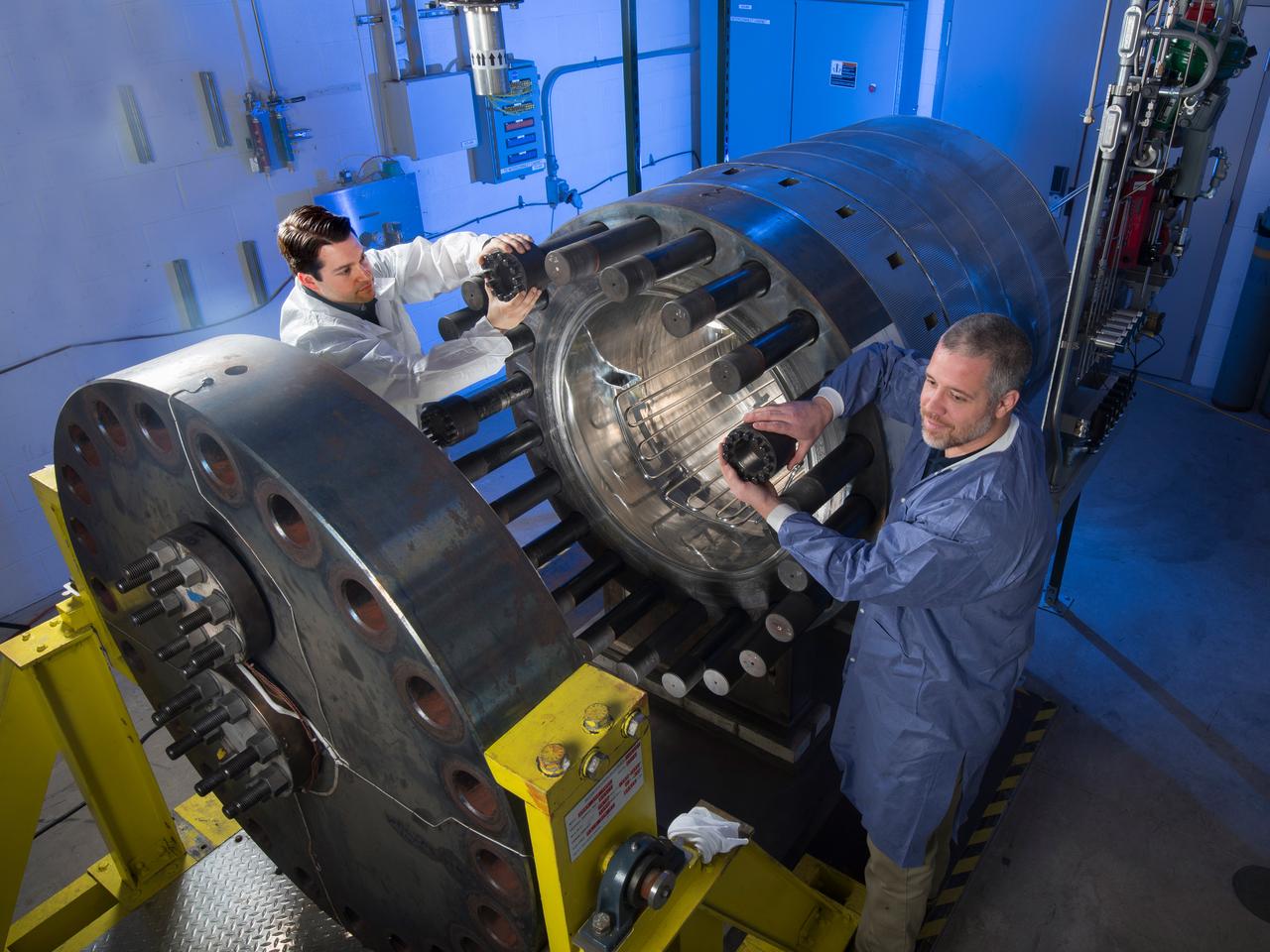 NASA Glenn research engineers prepare our extreme environments chamber (GEER) for a test. GEER, which simulates the extreme conditions found in space, tests many devices that will explore Venus to see if they can withstand the punishing environment and temperatures over 800˚F.