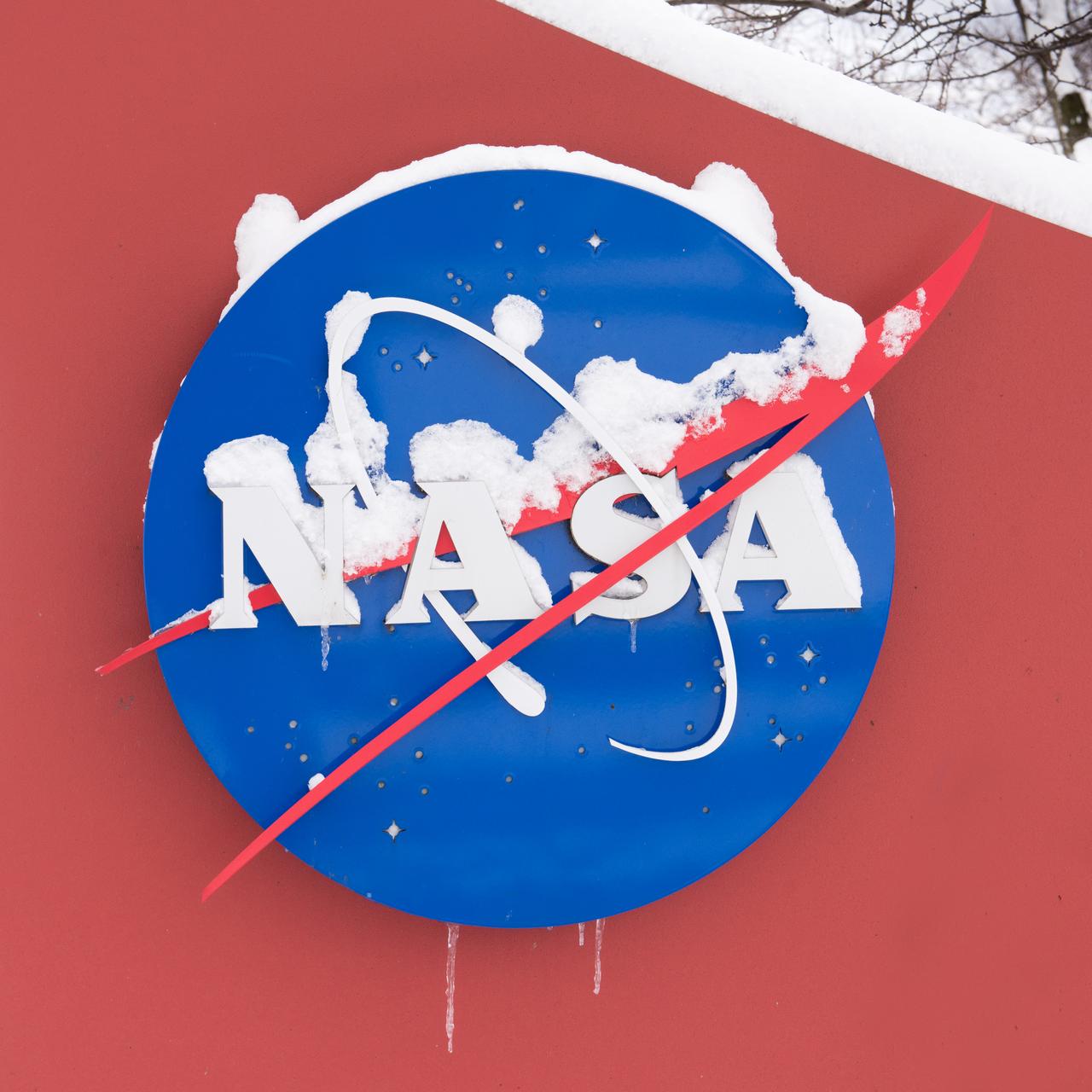 Late winter photograph of a snow-covered NASA Insignia at the Glenn Research Center in Cleveland, OH.