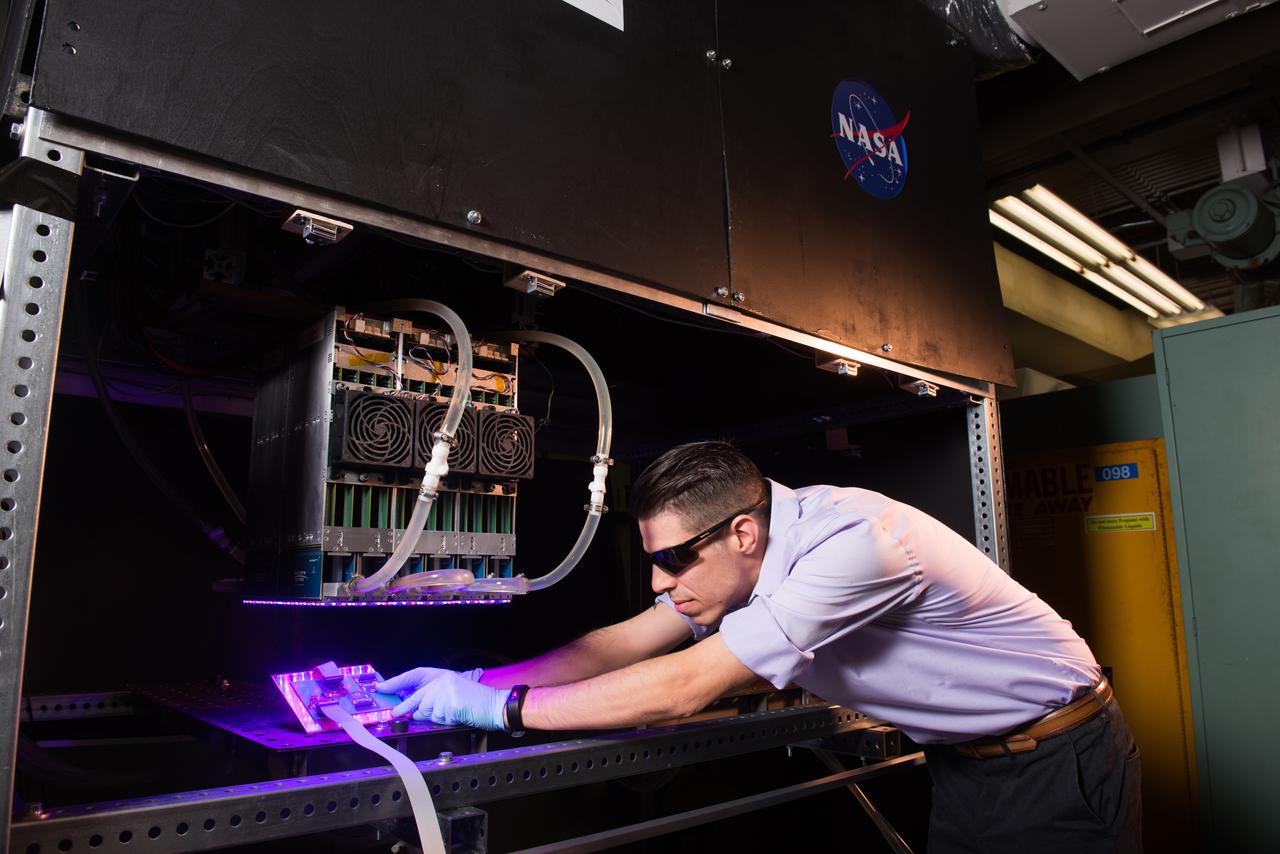 NASA Glenn researcher Tim Peshek shows off a new type of ultrathin solar cell, known as a ‘perovskite’ because of its structure. These solar cells show promise for space applications because of their high efficiency and radiation tolerance and open the door to extremely low cost and large solar arrays for spacecraft or lunar surface habitats.