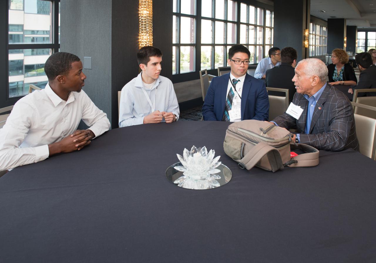 The inaugural Glenn Symposium focused on advancements in aerospace technology including power and propulsion, autonomy and communications, low boom supersonics, hypersonics, and more. Discussion also encompassed humans returning to the moon, including challenges associated with the 2024 mission.