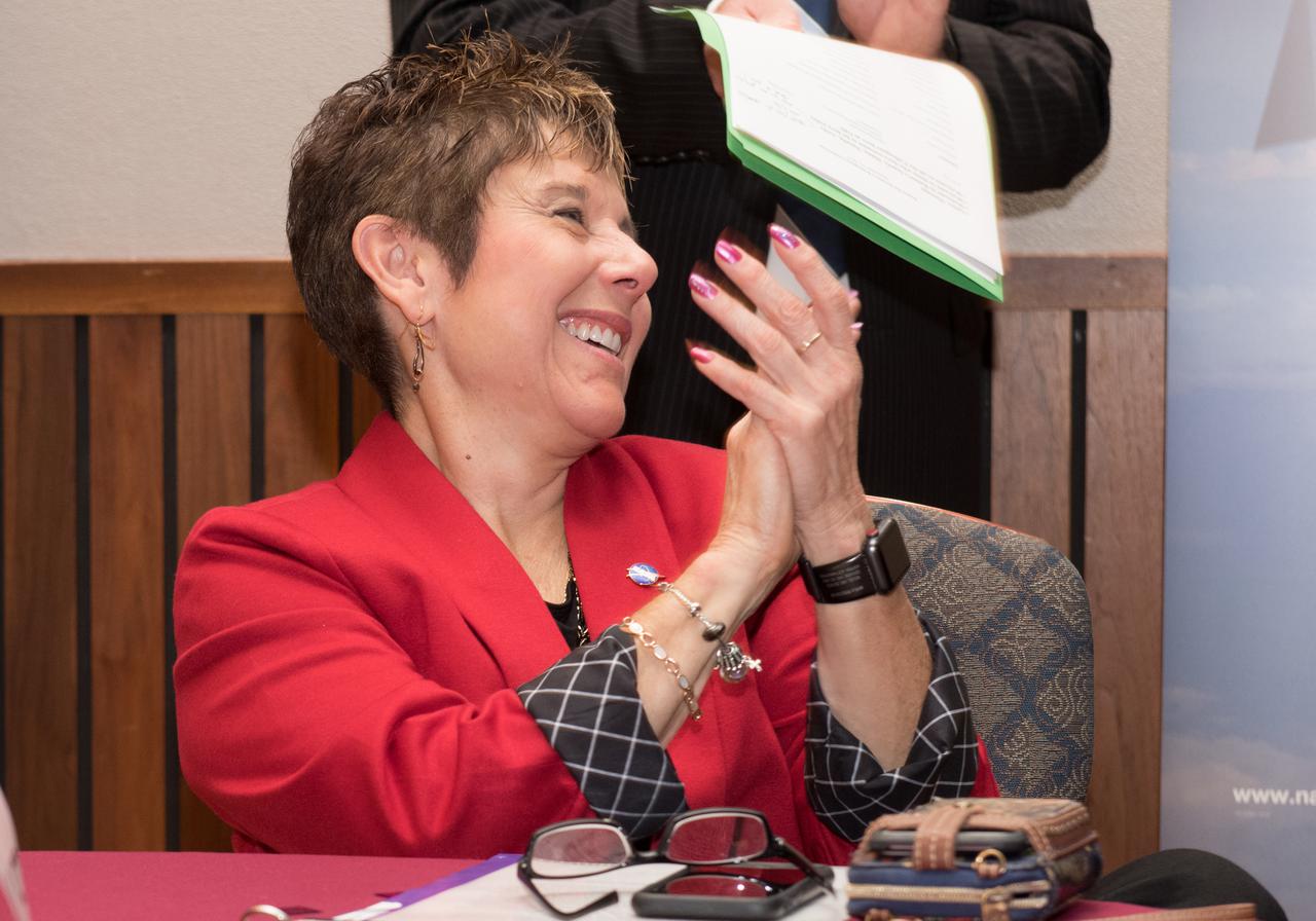 GRC Center Director, Dr. Marla Perez-Davis reacts to a presentation during the Retirement Reception for the Director of Aeronautics, Ruben Del Rosario