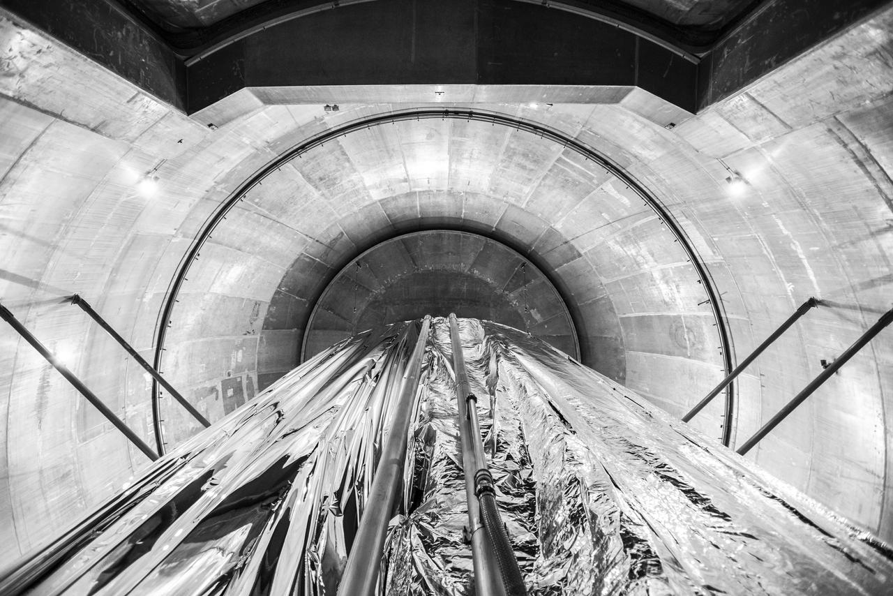 Space Environments Complex Vacuum Chamber. Cryoshroud, used to provide the thermal cold sink for Orion Vehicle testing. This view is looking at the west side of the Cryoshroud where the northwest and southwest walls intersect in the closed position.  The view is from the Space Environments Complex, SEC Vacuum Chamber floor, directly up towards the vacuum chamber dome.