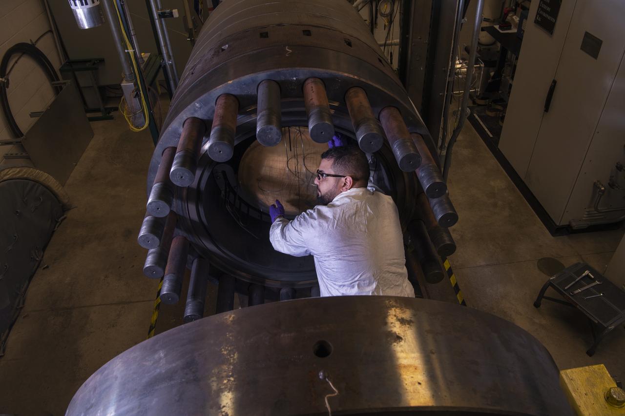 Juno testing in Glenn Extreme Environments Rig, GEER Laboratory.  Juno is a solar-powered NASA spacecraft that spans the width of a basketball court and makes long, looping orbits around giant planet Jupiter