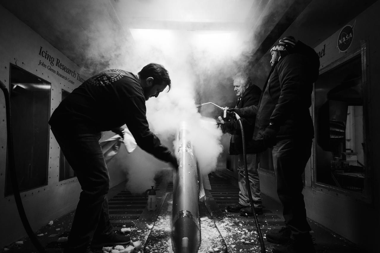 Technicians spray steam to help scrape off ice at the Icing Research Tunnel. The technicians need all the help they can get in sub-zero temperatures. Photo Credit: (NASA/Jordan Salkin)