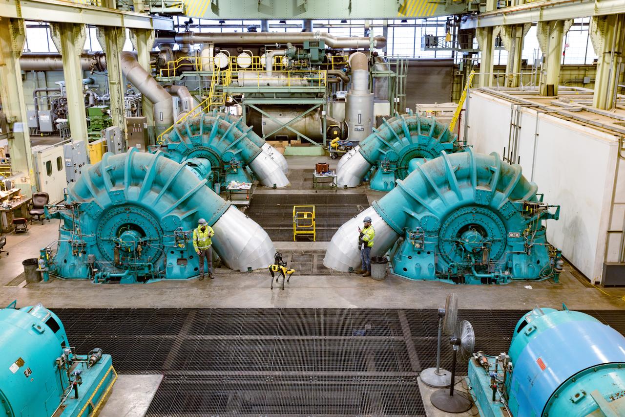 Astro, the robot dog conducts inspections in building 64 to spare the employees ears in this extremely loud environment. The facility is extremely loud even with double hearing protection, so Glenn has come up with an alternative to keep the employees safe. Astro is operated by staff via remote control, is fitted with an infrared camera with 40 times zoom, utilizes thermography and a microphone and can navigate all three levels of the facility. 