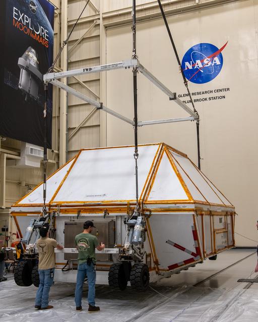 NASA image: The Crated Orion I Crew Module is lowered in the Space Experimen