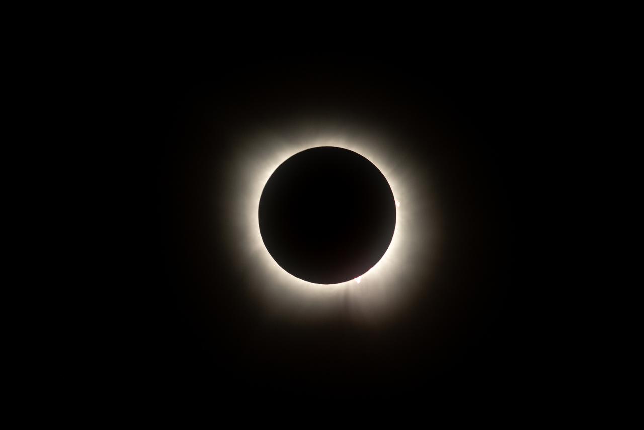 A total solar eclipse is seen from NASA's Glenn Research Center, Monday, April 8, 2024, in Cleveland, Ohio. A total solar eclipse swept across a narrow portion of the North American continent from Mexico’s Pacific coast to the Atlantic coast of Newfoundland, Canada. A partial solar eclipse was visible across the entire North American continent along with parts of Central America and Europe. Photo Credit: (NASA/Jordan Salkin) 