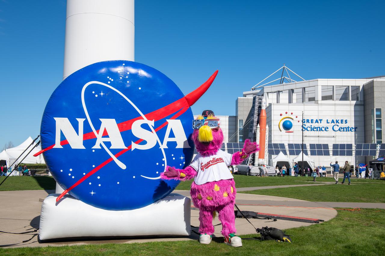The Cleveland Guardians mascot, Slider poses in front of the NASA sign at the Total Solar Eclipse Fest at the Great Lakes Science Center April 6, 2024. A total solar eclipse swept across a narrow portion of the North American continent from Mexico’s Pacific coast to the Atlantic coast of Newfoundland, Canada. A partial solar eclipse was visible across the entire North American continent along with parts of Central America and Europe.
