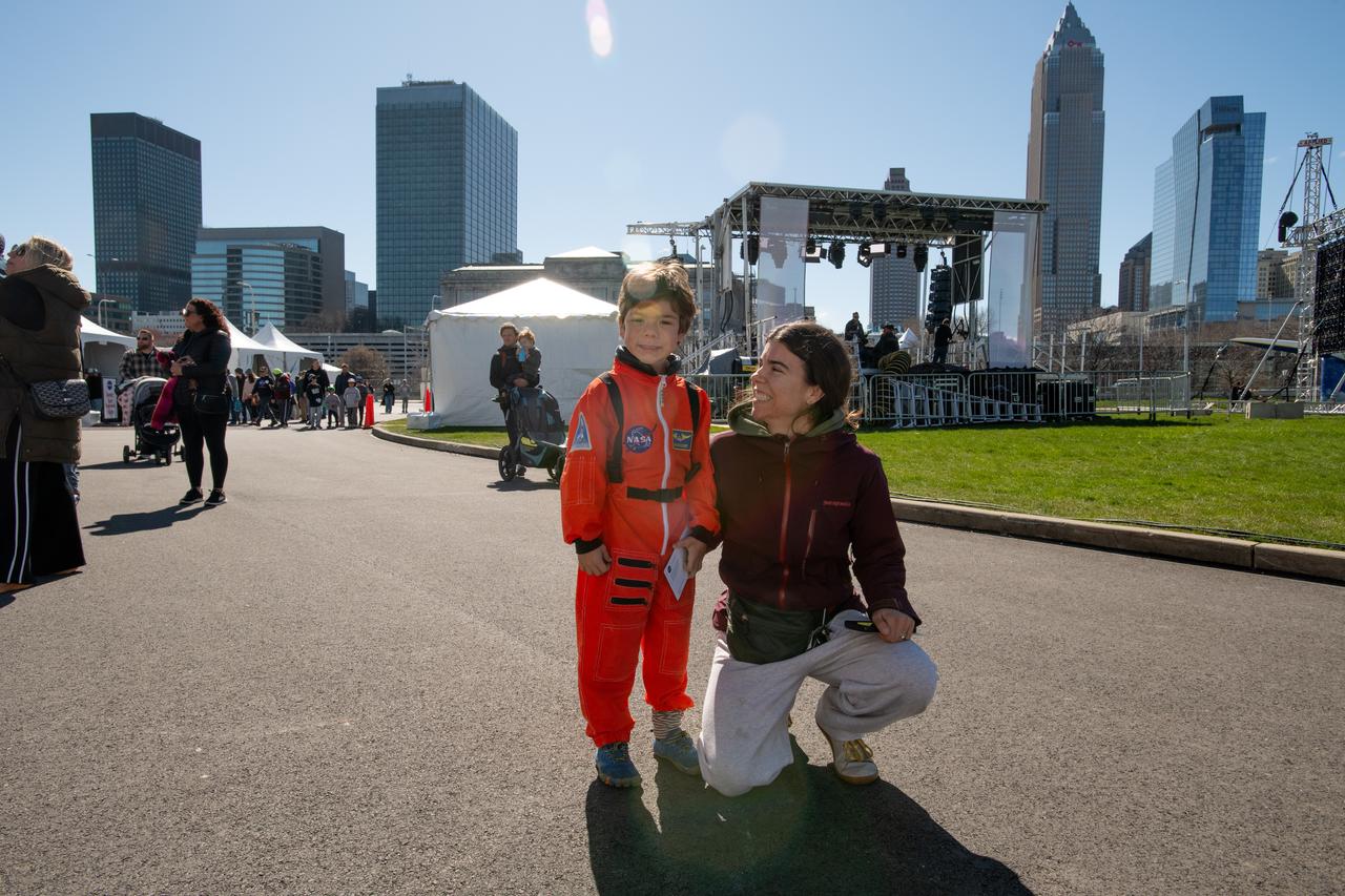Guests pose for a photo at the Total Solar Eclipse Fest at the Great Lakes Science Center in Cleveland, OH April 6, 2024. A total solar eclipse swept across a narrow portion of the North American continent from Mexico’s Pacific coast to the Atlantic coast of Newfoundland, Canada. A partial solar eclipse was visible across the entire North American continent along with parts of Central America and Europe.