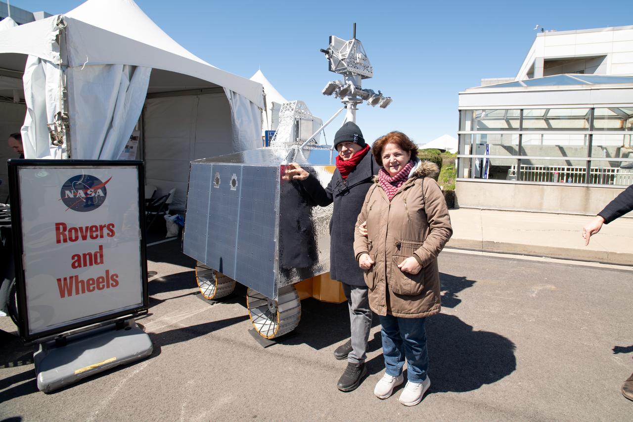 Event Attendees at pose in front of the VIPER model at the Total Eclipse Fest at the Great Lakes Science Center in Cleveland, OH April 6, 2024. A total solar eclipse swept across a narrow portion of the North American continent from Mexico’s Pacific coast to the Atlantic coast of Newfoundland, Canada. A partial solar eclipse was visible across the entire North American continent along with parts of Central America and Europe.