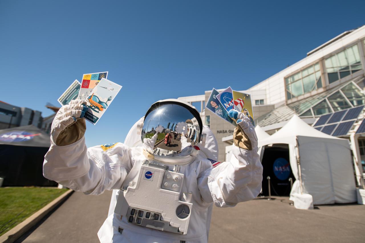 The astronaut mascot holds the 6 collectable postcards designed for the Total Eclipse Fest at the Great Lakes Science Center in Cleveland, OH on April 6, 2024. A total solar eclipse swept across a narrow portion of the North American continent from Mexico’s Pacific coast to the Atlantic coast of Newfoundland, Canada. A partial solar eclipse was visible across the entire North American continent along with parts of Central America and Europe.