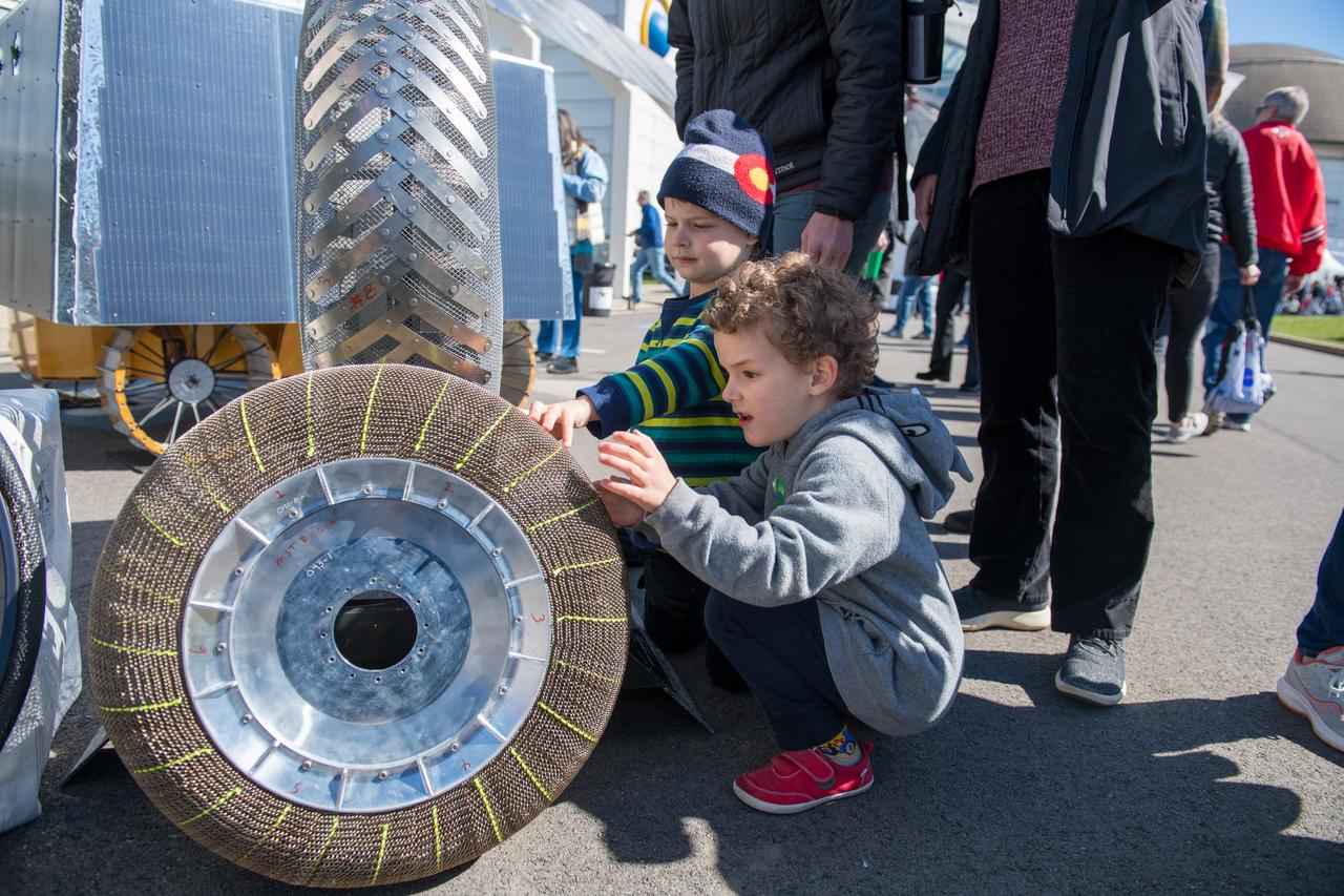An event attendee checks out a rover tire made with shape memory alloys at the Total Eclipse Fest at the Great Lakes Science Center in Cleveland, OH on April 7, 2024. A total solar eclipse swept across a narrow portion of the North American continent from Mexico’s Pacific coast to the Atlantic coast of Newfoundland, Canada. A partial solar eclipse was visible across the entire North American continent along with parts of Central America and Europe.