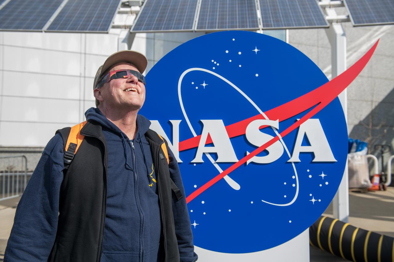 An event attendee views the eclipse on April 8, 2024. NASA Glenn Research Center and the Great Lakes Science Center hosted a three-day celestial celebration in downtown Cleveland, OH. This free, outdoor, family-friendly science and arts festival will feature free concerts, performances, speakers, and hands-on science activities with community partners. A total solar eclipse swept across a narrow portion of the North American continent from Mexico’s Pacific coast to the Atlantic coast of Newfoundland, Canada. A partial solar eclipse was visible across the entire North American continent along with parts of Central America and Europe. 