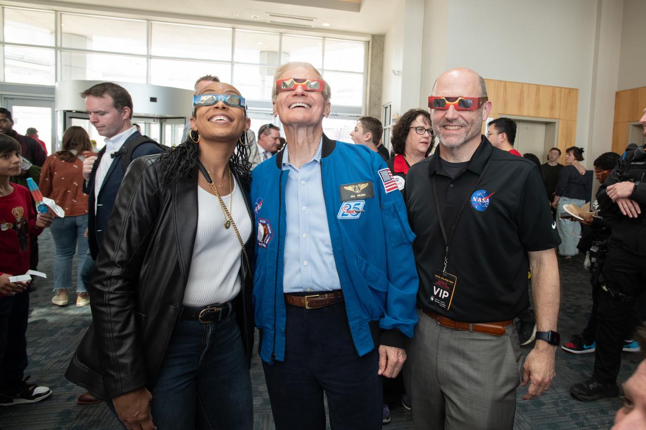 Representative Shontel Brown, Administrator Bill Nelson, GRC Center Director Jimmy Kenyon pose for a photo together with solar eclipse glasses on.  NASA Glenn Research Center and the Great Lakes Science Center hosted a three-day celestial celebration in downtown Cleveland, OH. This free, outdoor, family-friendly science and arts festival will feature free concerts, performances, speakers, and hands-on science activities with community partners. A total solar eclipse swept across a narrow portion of the North American continent from Mexico’s Pacific coast to the Atlantic coast of Newfoundland, Canada. A partial solar eclipse was visible across the entire North American continent along with parts of Central America and Europe. 