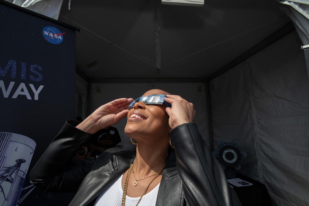 Representative Shontel Brown views the eclipse. NASA Glenn Research Center and the Great Lakes Science Center hosted a three-day celestial celebration in downtown Cleveland, OH. This free, outdoor, family-friendly science and arts festival will feature free concerts, performances, speakers, and hands-on science activities with community partners. A total solar eclipse swept across a narrow portion of the North American continent from Mexico’s Pacific coast to the Atlantic coast of Newfoundland, Canada. A partial solar eclipse was visible across the entire North American continent along with parts of Central America and Europe. Photo Credit: (NASA/Sara Lowthian-Hanna)