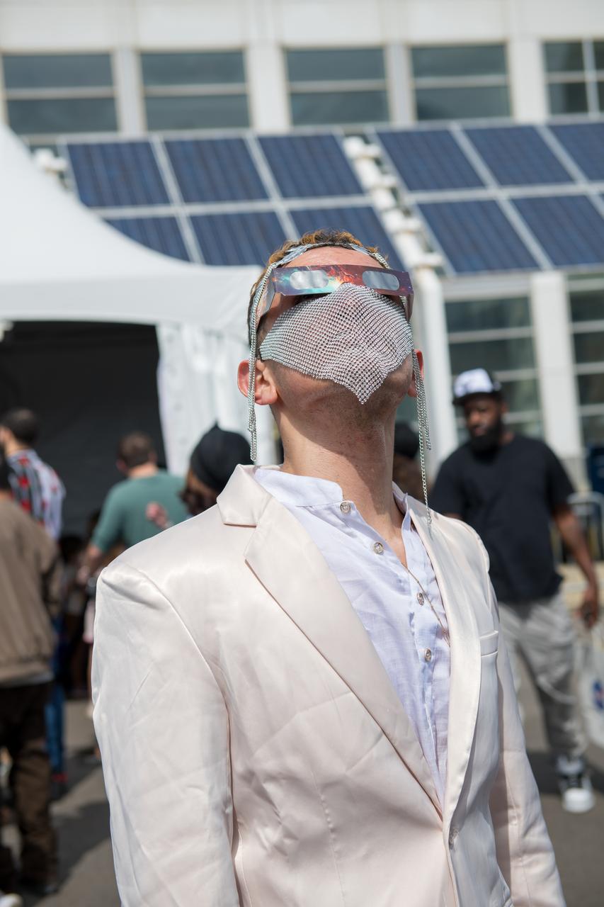 Event attendee views the eclipse. NASA Glenn Research Center and the Great Lakes Science Center hosted a three-day celestial celebration in downtown Cleveland, OH. This free, outdoor, family-friendly science and arts festival will feature free concerts, performances, speakers, and hands-on science activities with community partners. A total solar eclipse swept across a narrow portion of the North American continent from Mexico’s Pacific coast to the Atlantic coast of Newfoundland, Canada. A partial solar eclipse was visible across the entire North American continent along with parts of Central America and Europe. 