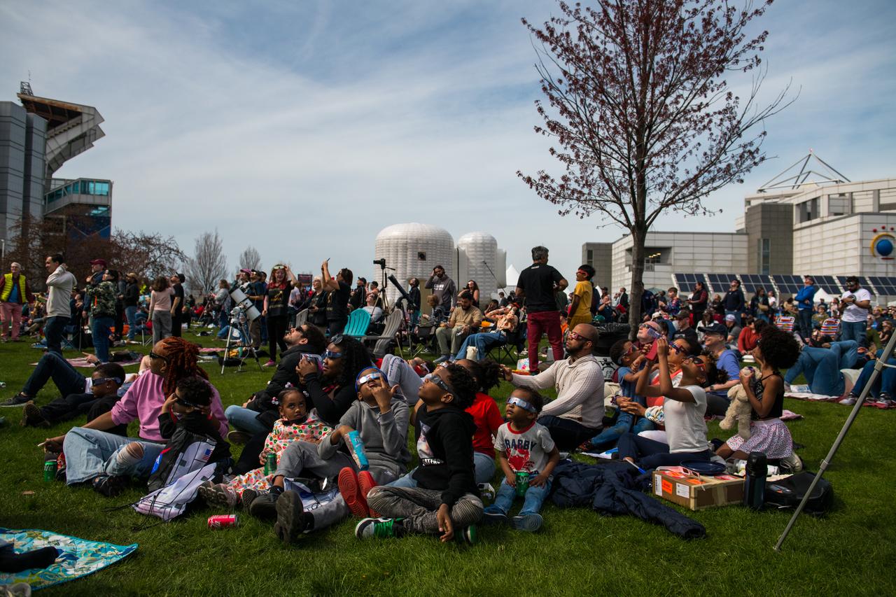 Event attendees view the eclipse. NASA Glenn Research Center and the Great Lakes Science Center hosted a three-day celestial celebration in downtown Cleveland, OH. This free, outdoor, family-friendly science and arts festival will feature free concerts, performances, speakers, and hands-on science activities with community partners. A total solar eclipse swept across a narrow portion of the North American continent from Mexico’s Pacific coast to the Atlantic coast of Newfoundland, Canada. A partial solar eclipse was visible across the entire North American continent along with parts of Central America and Europe. 