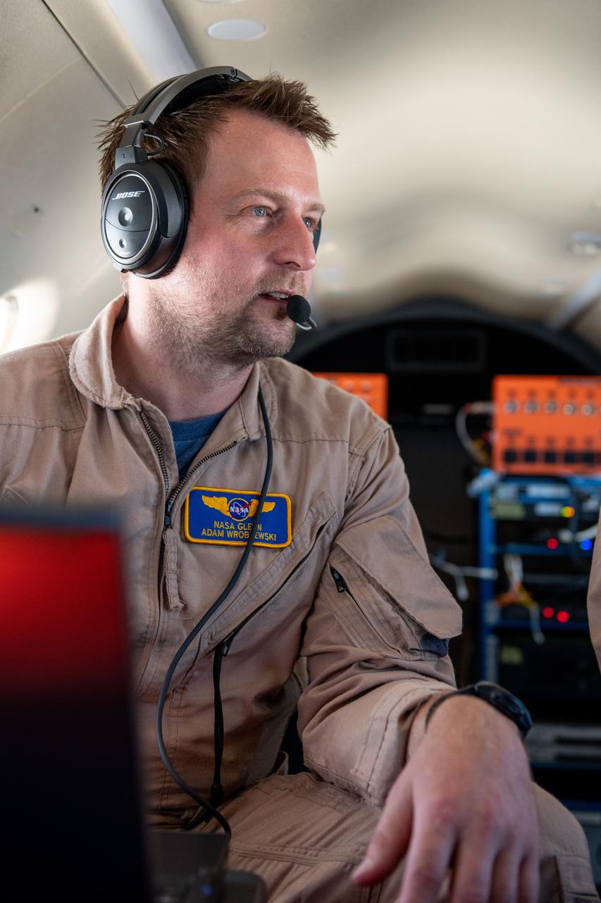 Adam Wroblewski p  A team at NASA’s Glenn Research Center in Cleveland streamed 4K video footage from an aircraft to the International Space Station and back for the first time using optical, or laser, communications. The feat was part of a series of tests on new technology that could provide live video coverage of astronauts on the Moon during the Artemis missions.  Working with the Air Force Research Laboratory and NASA’s Small Business Innovation Research program, Glenn engineers temporarily installed a portable laser terminal on the belly of a Pilatus PC-12 aircraft. Adam Wroblewski in the PC-12 over Lake Erie on June 13, 2024 sending data from the aircraft to an optical ground station in Cleveland. From there, it was sent over an Earth-based network to NASA’s White Sands Test Facility in Las Cruces, New Mexico, where scientists used infrared light signals to send the data. Photo Credit: (NASA/Sara Lowthian-Hanna)