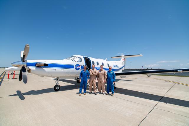 NASA image: Laser Comm Team Poses In Front Of PC-12 Aircraft