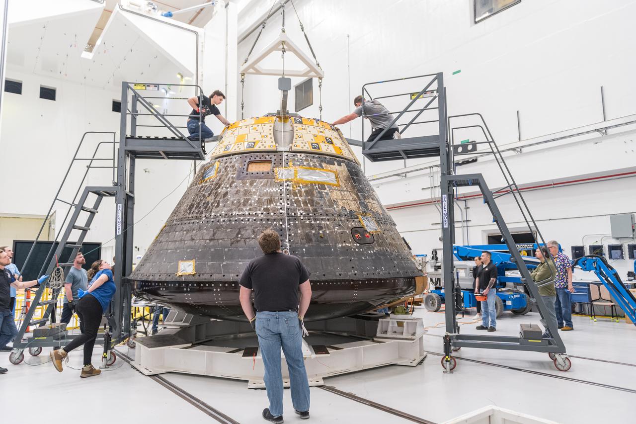 The Orion Crew Module, also known as the Orion Environmental Test Article (ETA), prepares for testing by installing the Forward Bay Cover. The Crew Module returned to NASA’s Neil Armstrong Test Facility in Sandusky, Ohio, in January 2024 and completed an 11-month test campaign necessary for the safety and success of Artemis II. Photo Credit: (NASA/Jordan Salkin)