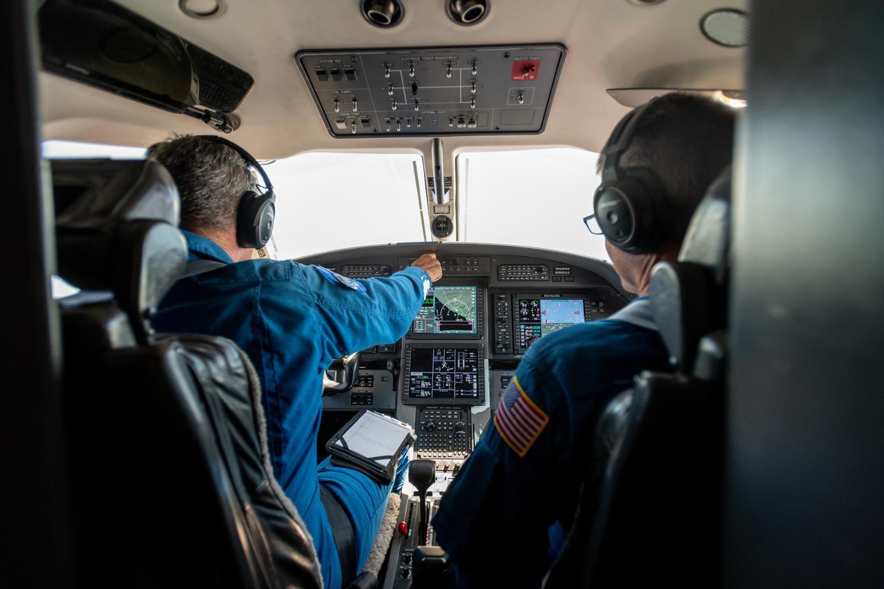 Kurt Blankenship and James Demers Fly PC-12 Aircraft During Testing on June 13, 2024.  A team at NASA’s Glenn Research Center in Cleveland streamed 4K video footage from an aircraft to the International Space Station and back for the first time using optical, or laser, communications. The feat was part of a series of tests on new technology that could provide live video coverage of astronauts on the Moon during the Artemis missions.  Working with the Air Force Research Laboratory and NASA’s Small Business Innovation Research program, Glenn engineers temporarily installed a portable laser terminal on the belly of a Pilatus PC-12 aircraft. They then flew over Lake Erie sending data from the aircraft to an optical ground station in Cleveland. From there, it was sent over an Earth-based network to NASA’s White Sands Test Facility in Las Cruces, New Mexico, where scientists used infrared light signals to send the data. Photo Credit: (NASA/Sara Lowthian-Hanna)