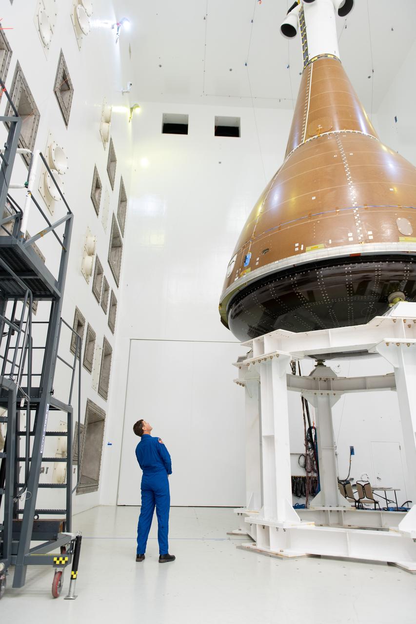 The team at NASA's Armstrong Test Facility in Sandusky, Ohio has begun vibro-acoustic testing on the Orion spacecraft that flew around the Moon on Artemis I, now known as the Environmental Test Article. The testing will help ensure the safety of future crews aboard Orion.  Commander Reid Wiseman looks up at the Orion capsule during tours on September 11, 2024 of the acoustic lab. Photo Credit: (NASA/Sara Lowthian-Hanna)