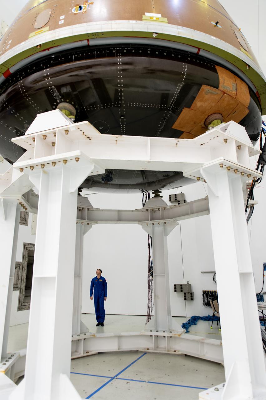The team at NASA's Armstrong Test Facility in Sandusky, Ohio has begun vibro-acoustic testing on the Orion spacecraft that flew around the Moon on Artemis I, now known as the Environmental Test Article. The testing will help ensure the safety of future crews aboard Orion.  Mission Specialis Jeremy Hansen looks up at the Orion capsule during tours of the acoustic lab.