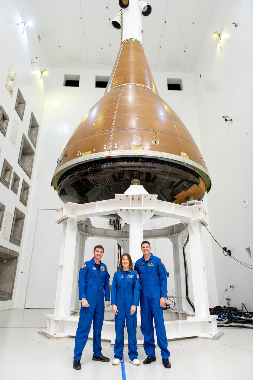 Commander Reid Wiseman, Mission Specialist Christina Koch and Mission Specialist Jeremy Hansen pose in front of the Orion Environmental Test Article at Armstrong Test Facility in Sandusky, OH on September 11, 2024.   The team has begun vibro-acoustic testing on the Orion spacecraft that flew around the Moon on Artemis I, now known as the Environmental Test Article. The testing will help ensure the safety of future crews aboard Orion.  Employees meet three of the four astronauts who will venture around the Moon on Artemis II, the first crewed flight paving the way for future lunar surface missions. Commander Reid Wiseman and Mission Specialists Christina Koch and Jeremy Hansen will be on hand to discuss their upcoming mission and participate in a Question and Answer session with employees afterward. Hansen is an astronaut with the Canadian Space Agency. Victor Glover, the pilot and fourth crew member, will not be present.   Awards were given to employees that participated in Orion for Artemis I. Photo Credit: (NASA/Sara Lowthian-Hanna)  