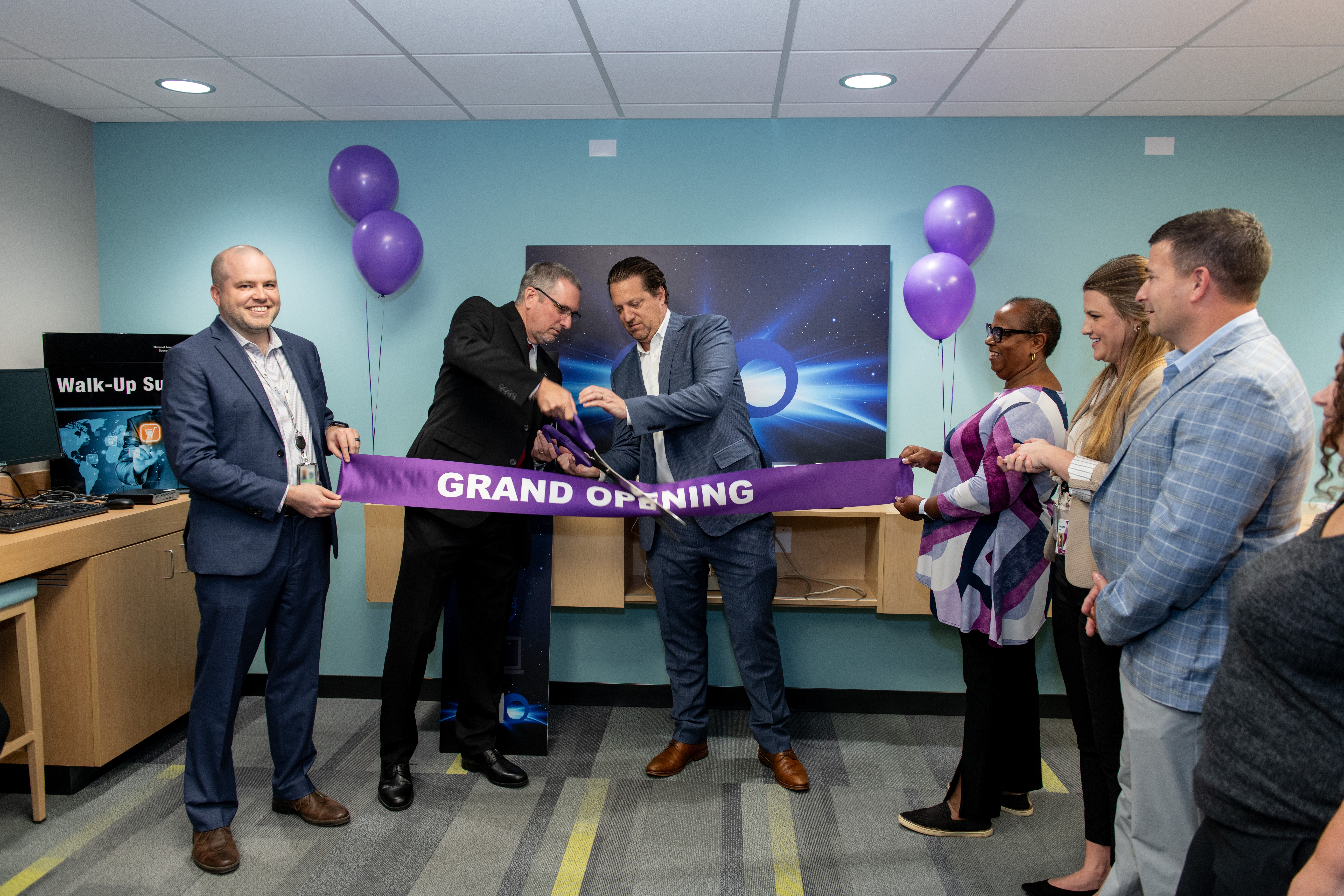 On Tuesday, Sept. 17, NASA IT hosted the Grand Opening for SpaceBar at Glenn Research Center (GRC), leading the way for enhanced IT customer service to NASA users!   NEST corporate representatives and the Chief and Deputy Chief of OCIO cut the ribbon.  The SpaceBar provides a place for walk-up IT service from our friendly, highly skilled service technicians coupled with a storefront atmosphere where NASA users can touch, feel, and test the latest and greatest hardware that NASA IT offers. Customers with NASA IT equipment and agency-managed services have the option to visit SpaceBar for their IT needs or continue to use remote/virtual access and deskside service. 