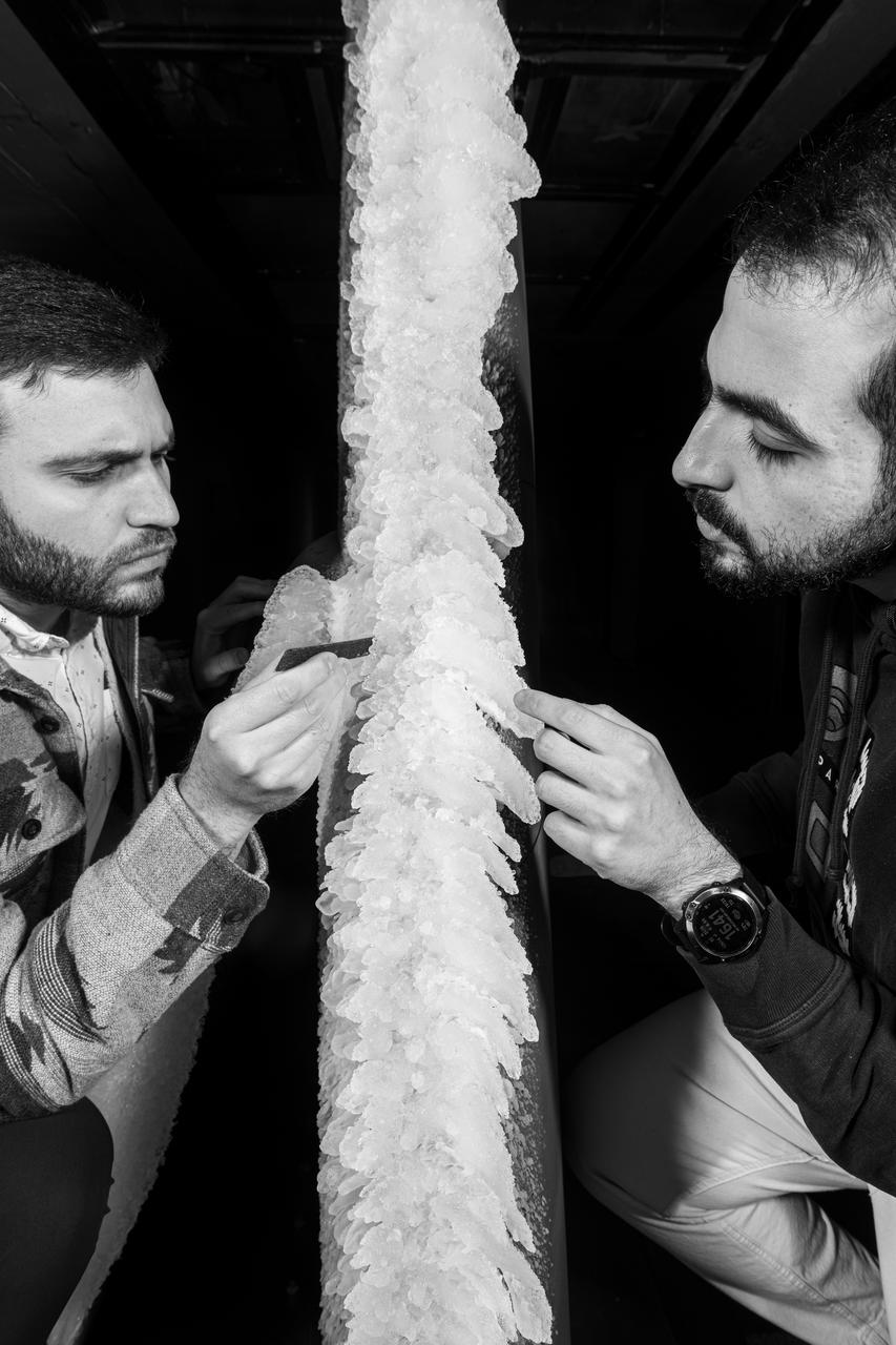 Zaid Sabri and Thomas Ozoroski, Icing Researchers, are shown documenting ice accretion on the leading edge of the next-generation Transonic Truss-Braced Wing design at NASA Glenn's Icing Research Center. This critical research will help understand icing effects for future, high-lift, ultra-efficient aircraft. Photo Credit: (NASA/Jordan Salkin)