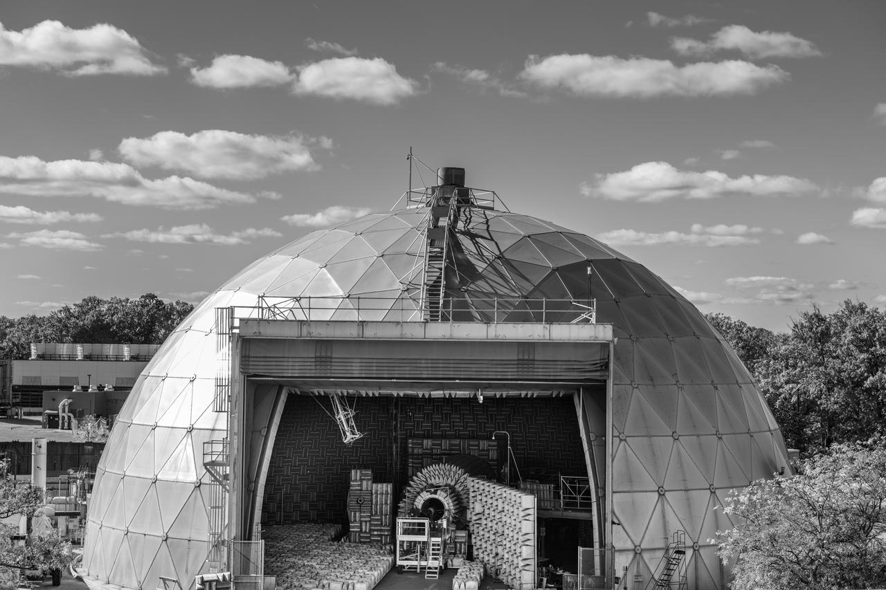 The Aero-Acoustic Propulsion Laboratory (AAPL) photographed on October 24, 2024 as seen from above.  This facility provides world class testing for aircraft propulsion acoustic noise reduction and is 65 ft high by 130 ft in diameter. Photo Credit: (NASA/Sara Lowthian-Hanna)