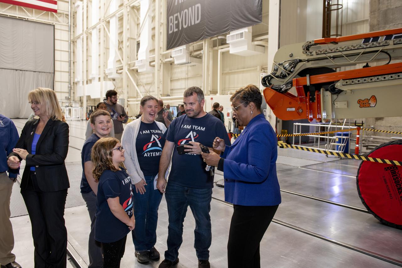 On Thursday, Nov. 21, employees supporting Artemis were invited to attend an appreciation event, “The Road to the Moon,” at Armstrong Test Facility in Sandusky, Ohio. Acting Deputy Director Dr. Wanda Peters interacts with the Hartenstine Family.   NASA employees and support service contractors for Artemis Friends and Family Day had the opportunity to hear from center leadership and see the Orion module that flew around the Moon and back during 2022’s Artemis I mission. Photo Credit: (NASA/Sara Lowthian-Hanna)