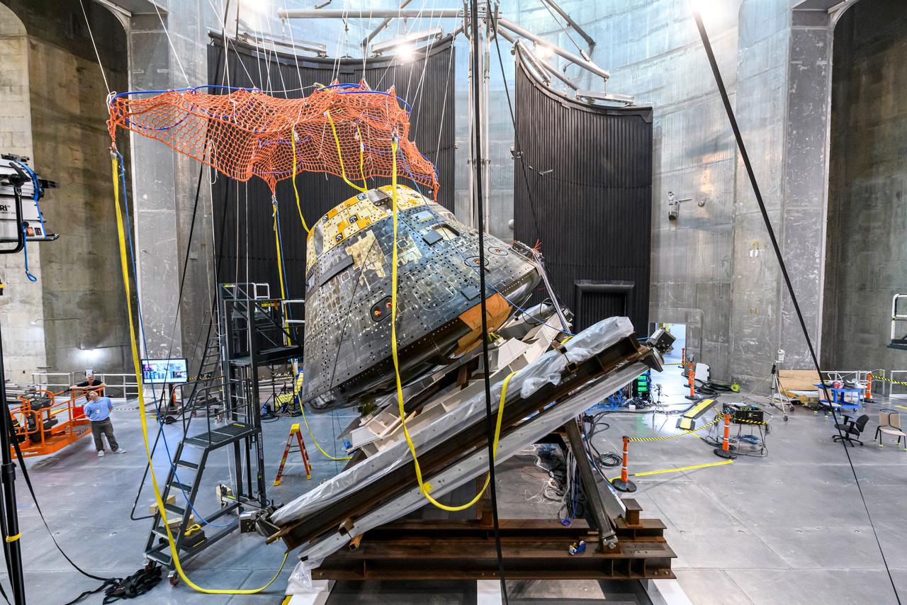 The Orion Crew Module, also known as the Orion Environmental Test Article (ETA), returned to NASA’s Neil Armstrong Test Facility in Sandusky, Ohio, in January 2024 and completed an 11-month test campaign necessary for the safety and success of Artemis II. In November 2024, experts completed the Forward Bay Cover jettison test, which is the last piece that must eject right before parachutes deploy. This image shows the setup right before the FBC deployment test. Photo Credit: (NASA/Jordan Salkin)