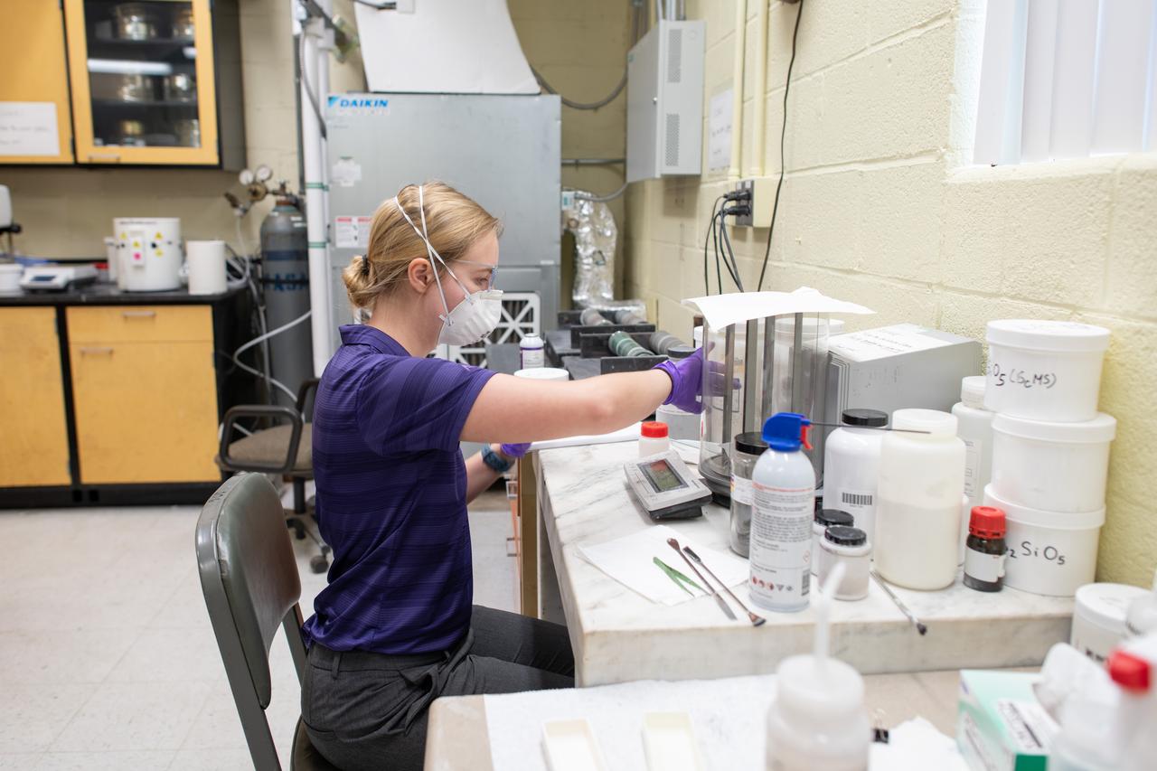 Sylvie Crowell who works in the Environmental Effects and Coatings Branch at NASA Glenn Research Center performs ball milling and particle size analysis on some lunar dust simulant on January 29, 2025.